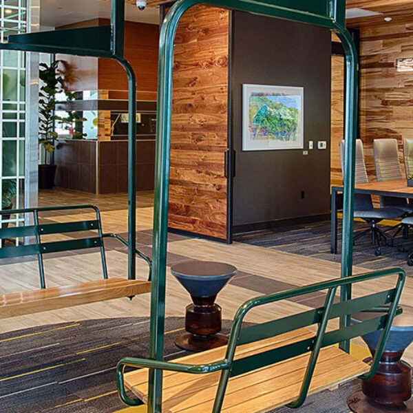 SOVA apartments lounge with ski lift seating and eclectic decor.